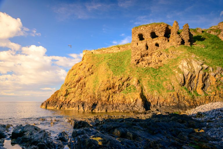 Findlater Castle is the old seat of the Earls of Findlater and Seafield, sitting on a 50-foot-high cliff overlooking the Moray Firth on the coast of Banff and Buchan, Aberdeenshire. It lies about 15 km west of Banff, near the village of Sandend, between Cullen and Portsoy.